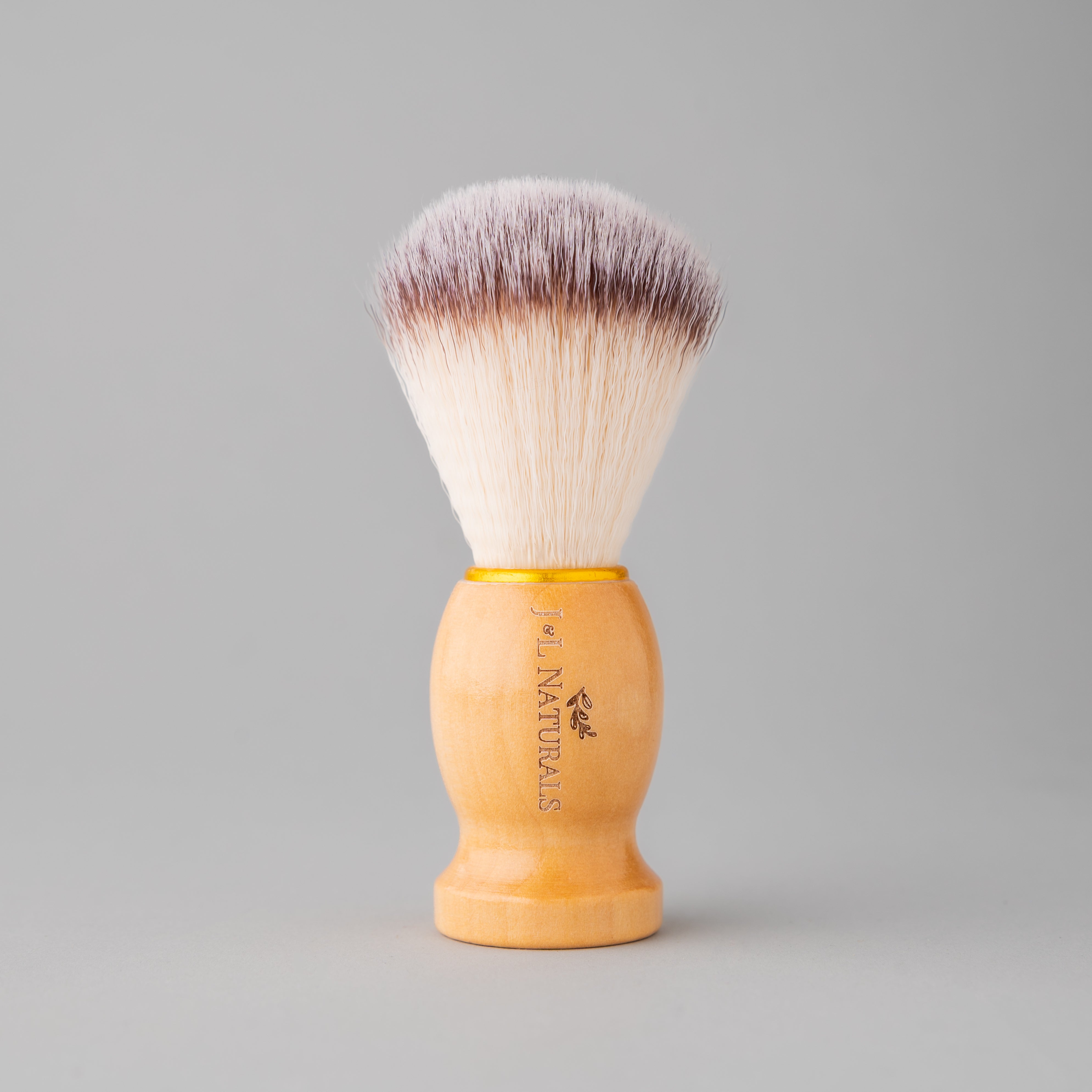 shave brush upright with grey background