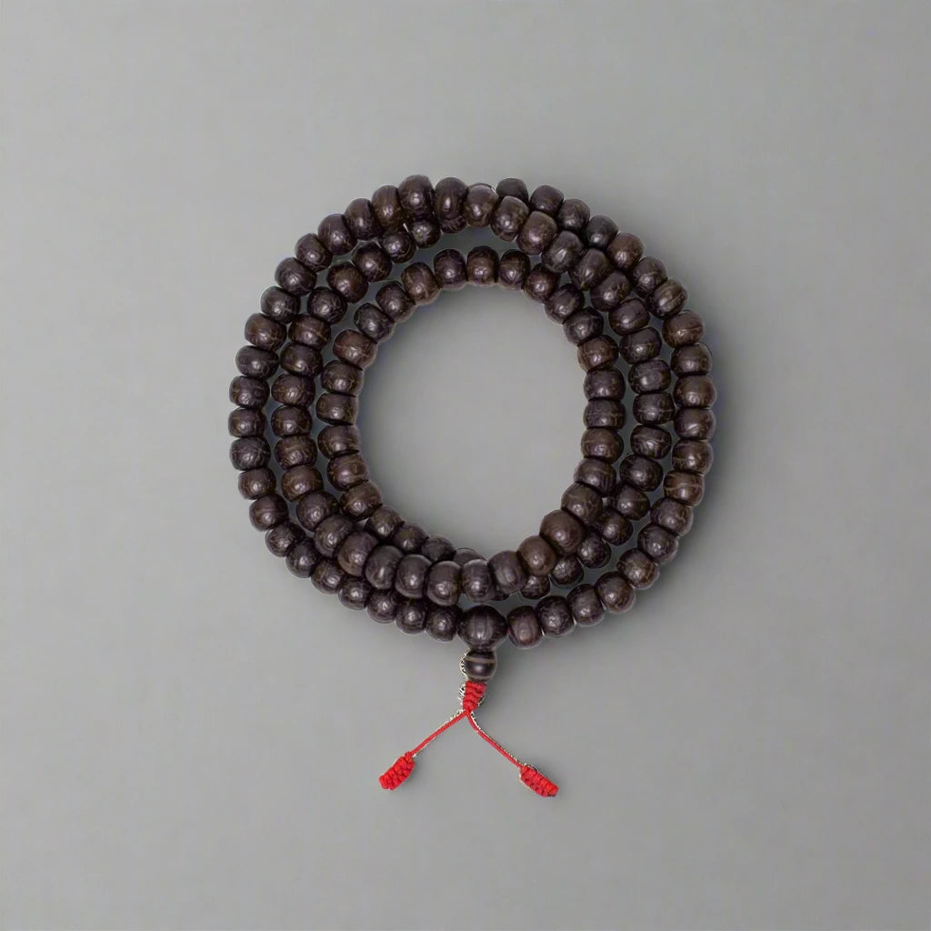 strand of beads circled white background