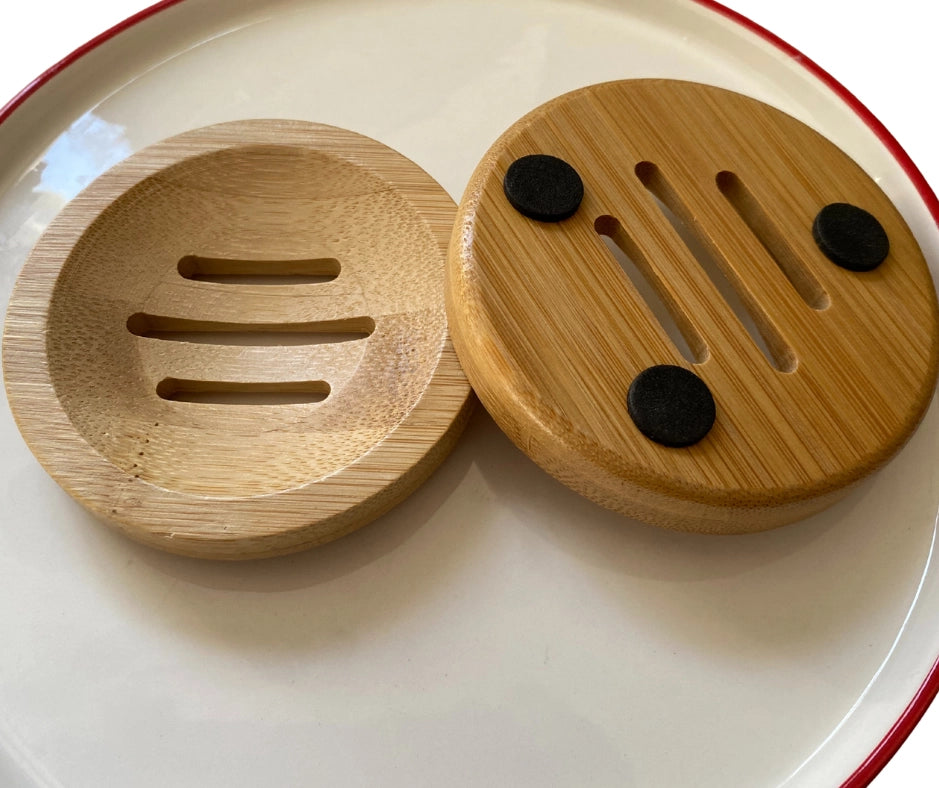 two wooden soap holders on a white plate