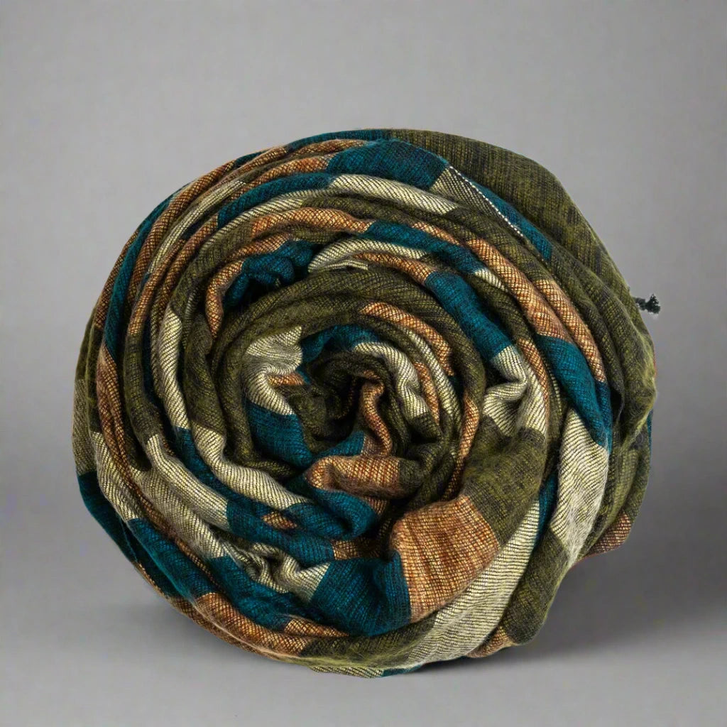 swirled yak wool blanket with earth tone stripes 